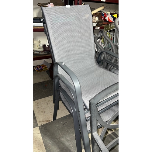 254 - New, Three stackable outdoor patio dining chairs with steel frame and breathable mesh fabric.
