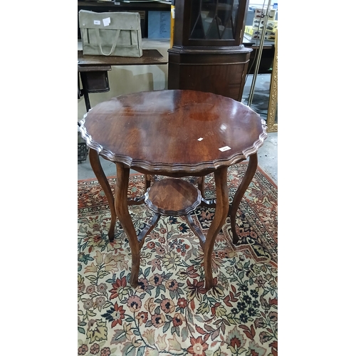 478 - Antique mahogany two-tier occasional side table featuring a scalloped edge top.