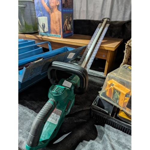 61F - Bosch AHS 50-20 LI cordless hedge trimmer, featuring a green and black design with a 50cm blade.