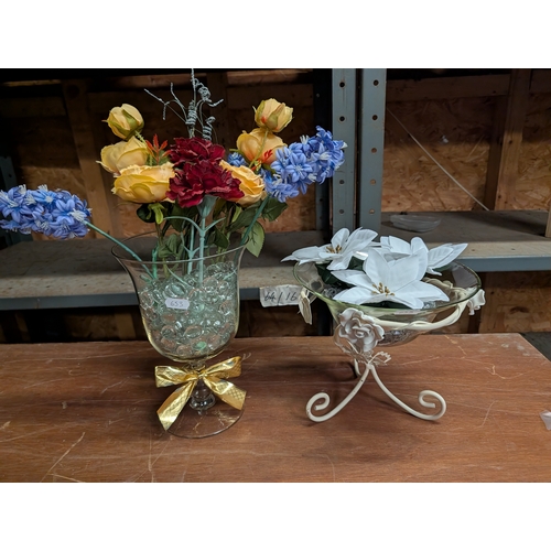 60D - assorted artificial flower arrangements featuring a variety of colorful blooms and stylized containe... 
