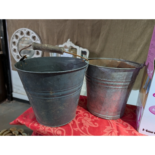 59E - vintage galvanised metal buckets used as rustic garden planters or decorative storage.