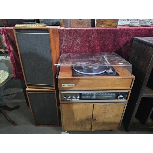 102 - Pye Cambridge stereogram or radiogram featuring a turntable, built-in radio receiver, and matching s... 