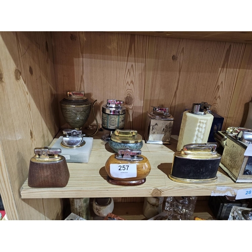 257 - Collection of vintage lighters to include oriental brass and wooden lighters