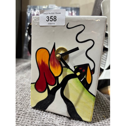 358 - Lorna Bailey “Hillside Cottage” Art Deco Style Ceramic Clock
Vibrantly decorated ceramic cupboard/ma... 