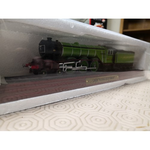 726 - 3 boxed models, a LNER Flying Scotsman train, a Duchess LMS train and an autoshop 69 SS 396 Camaro