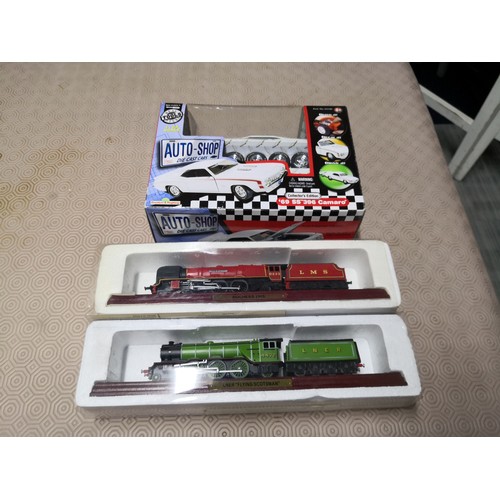 726 - 3 boxed models, a LNER Flying Scotsman train, a Duchess LMS train and an autoshop 69 SS 396 Camaro