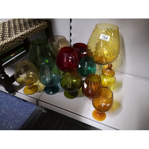 764 - 12 coloured glass balloon vases of assorted sizes and colours