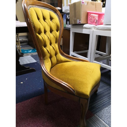 776 - Balloon back upholstered nursing chair in mustard velour fabric