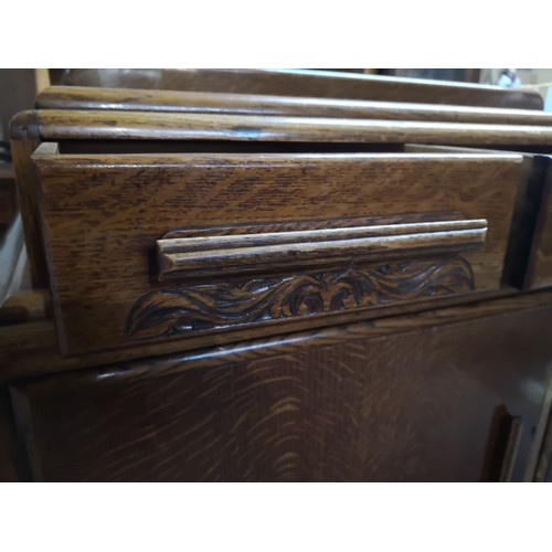 804 - 1950's style oak sideboard with 3 drawers to top and 2 doors to base cabinet. Decorative mouldings t... 