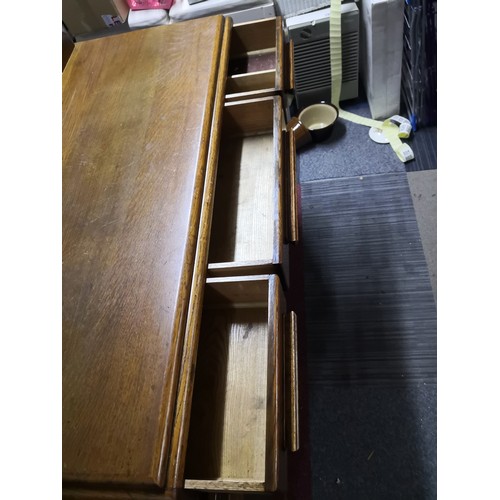 804 - 1950's style oak sideboard with 3 drawers to top and 2 doors to base cabinet. Decorative mouldings t... 