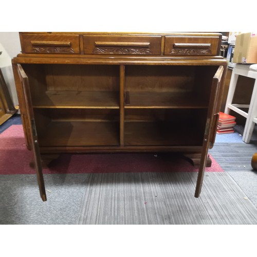 804 - 1950's style oak sideboard with 3 drawers to top and 2 doors to base cabinet. Decorative mouldings t... 