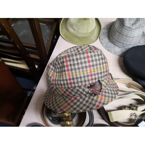 809 - Selection of gentleman's hats, belts and braces.