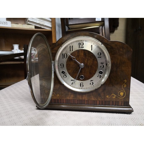 819 - Inlaid mantle clock measuring 27 cms wide and 24 cms tall.Complete with key