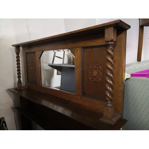 824 - Oak over-mantle mirror with barley twist supports and Art deco  design