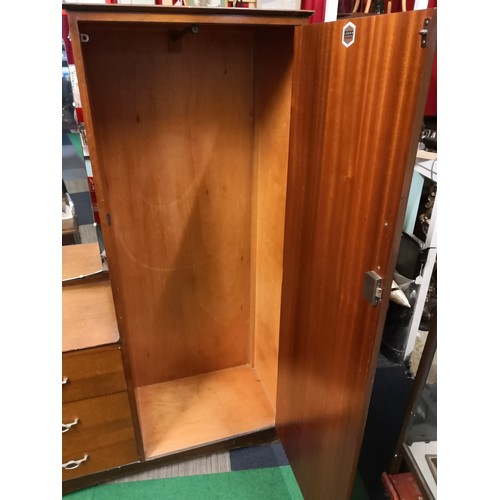 830 - Gentlemans wardrobe with hanging space to one side and 3 drawers to other side and a mirror above dr... 