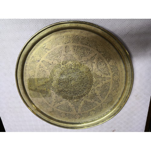 842 - 3 large embossed brass plates, large round plate measures 58 cms diameter, smaller round one is 50 c... 