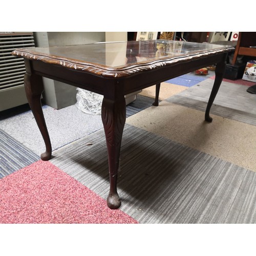 879 - Inlaid coffee table with glass top measuring 95 cms wide x 46 cms deep and 44 cms tall