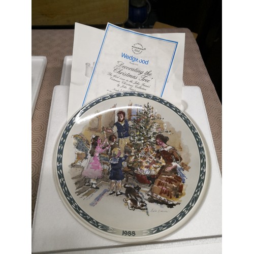 880 - 4 x 1980's Wedgewood collectable plates, The Caroler's, Decorating the Christmas tree, The Bell Ring... 