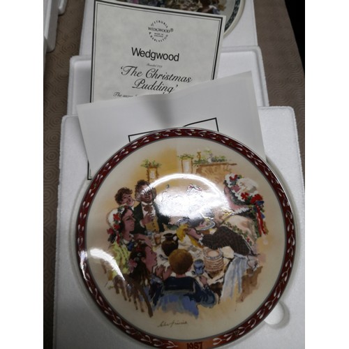 880 - 4 x 1980's Wedgewood collectable plates, The Caroler's, Decorating the Christmas tree, The Bell Ring... 