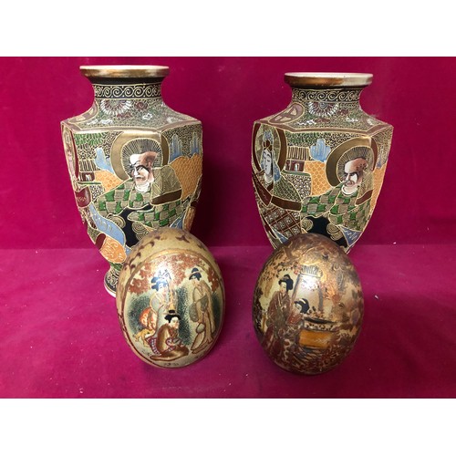 733 - Pair of decorative urns and pair of decorative egg shaped ornaments.