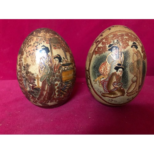 733 - Pair of decorative urns and pair of decorative egg shaped ornaments.