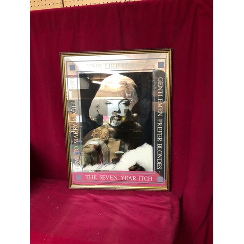 740 - Advertising mirror of Marilyn Monroe films, measures 64cms x 48cms