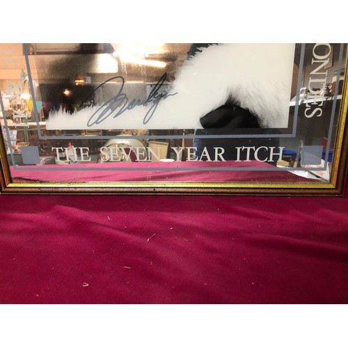 740 - Advertising mirror of Marilyn Monroe films, measures 64cms x 48cms