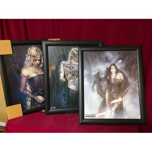 741 - Four pictures in black frames from the Luis Royo Collection depicting semi nude women. They all meas... 