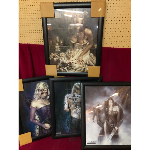 741 - Four pictures in black frames from the Luis Royo Collection depicting semi nude women. They all meas... 