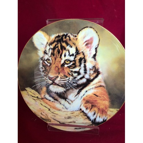 747 - Set of 4 decorative plates by Royal Doulton depicting Tigers