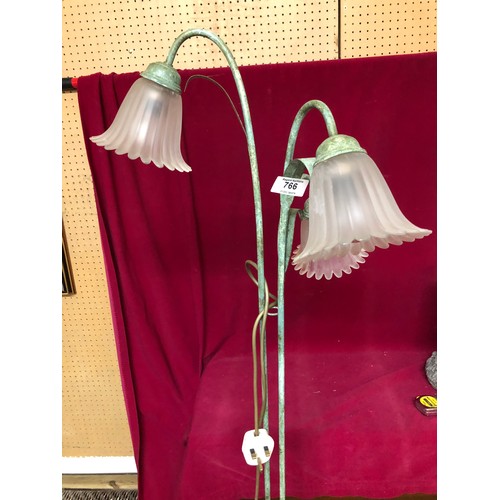 766 - Standing Lamp in green metal with 3 white flower shaped shades standing 150cms tall