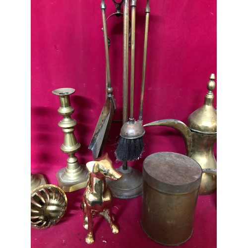 780 - Large box of Brassware including jugs, fireside set and candlesticks