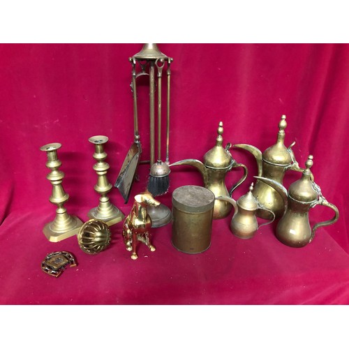 780 - Large box of Brassware including jugs, fireside set and candlesticks