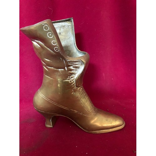 60 - A brass boot measuring 22 cms tall and 3 brass figures on horseback made in Italy measuring 10cms ta... 