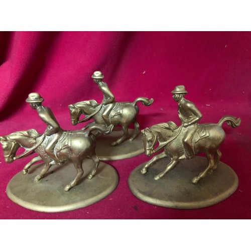 60 - A brass boot measuring 22 cms tall and 3 brass figures on horseback made in Italy measuring 10cms ta... 