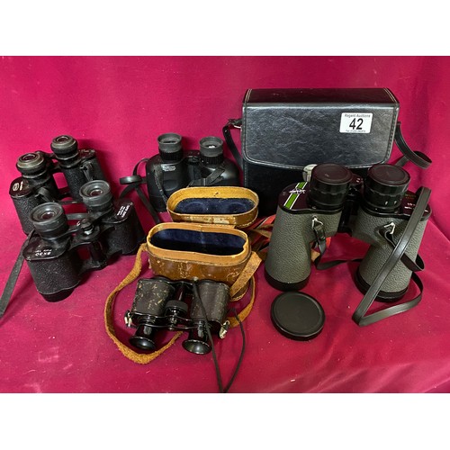 42 - Selection of binoculars, some with cases.