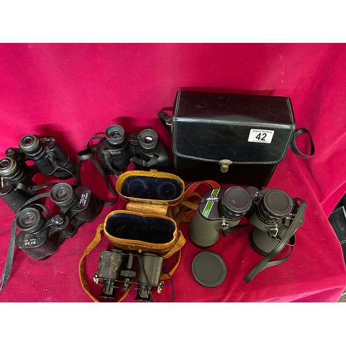 42 - Selection of binoculars, some with cases.