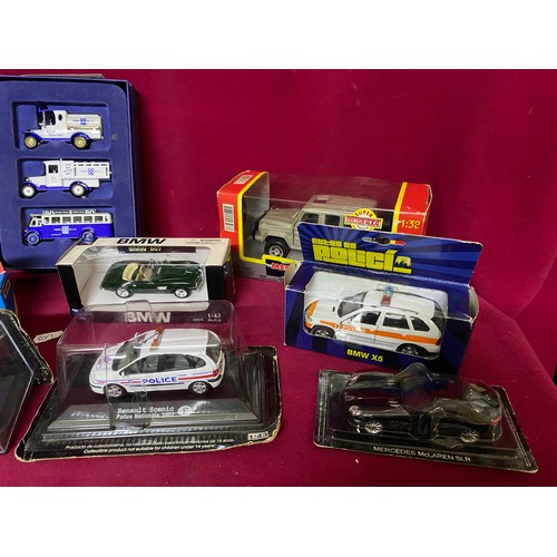 56 - 11 boxed diecast models including Burago, Welly and New Ray