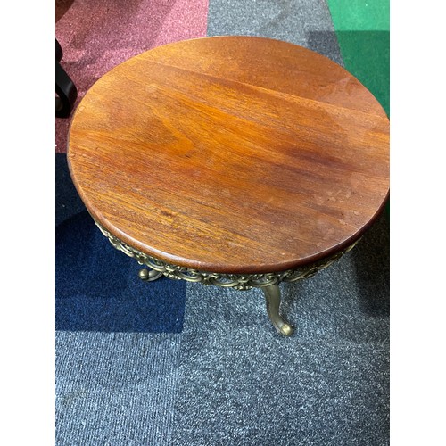 696 - Brass occasional table with wood top measuring 40 cms diameter