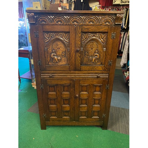 719 - Dark Oak cocktail cabinet, 2 doors to top with seahorse hinges, sliding drawer and 2 door cupboard t... 