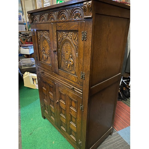 719 - Dark Oak cocktail cabinet, 2 doors to top with seahorse hinges, sliding drawer and 2 door cupboard t... 