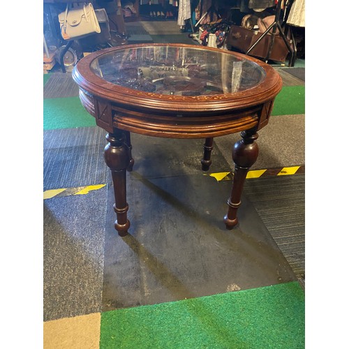 997 - Round ocassional table with glass top, intricate carved centre and brass inlaid surround measuring 5... 