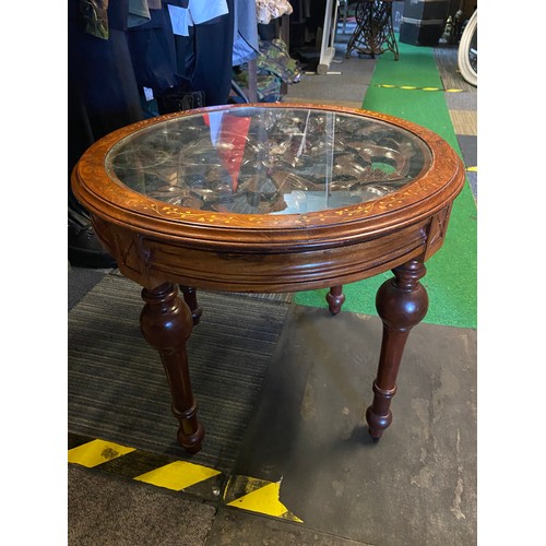 997 - Round ocassional table with glass top, intricate carved centre and brass inlaid surround measuring 5... 