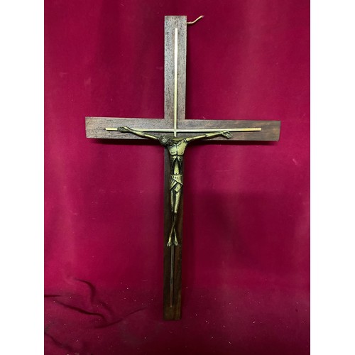 642 - Crucifix on wood 63cms and another on metal 45cms. Continental in design.