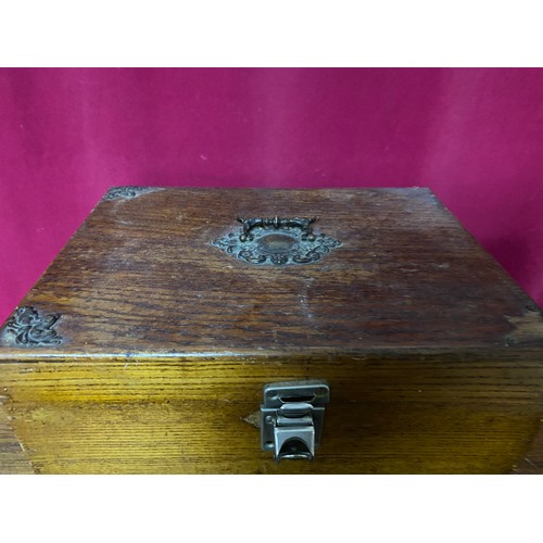 621 - 2 wooden boxes, one with decorative metal trim, one larger plain one with brass handles. Largest mea... 