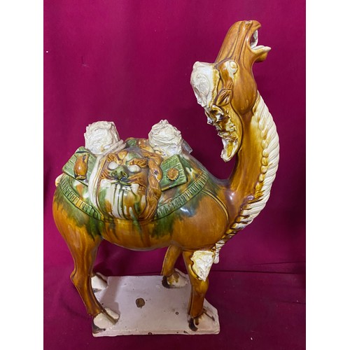 14 - Pair of porcelain camels measuring 42 cms tall