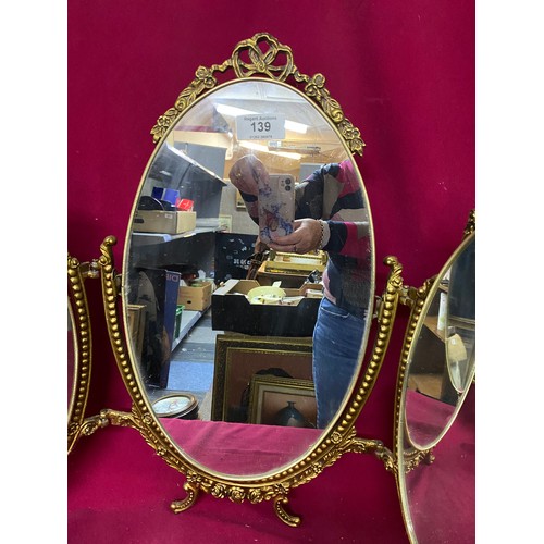 139 - Triple Vanity mirror with gold metal ornate frame measuring 58 cms tall