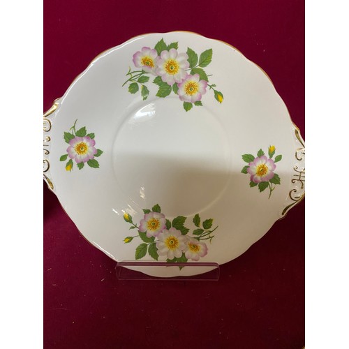 220 - A Royal Standard Wild Rose teaset comprising sandwich plate, 6 side plates, 6 saucers, 4 cups, milk ... 