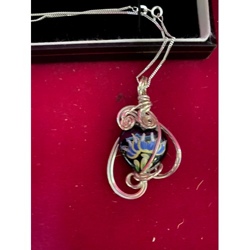 100 - Sterling silver chain and pendant