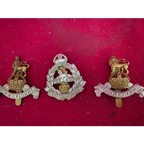 45 - Selection of Military cap badges, knife and trench art lighter.